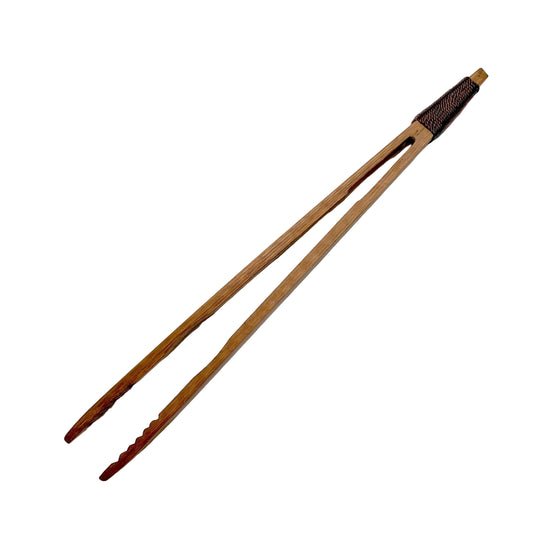 Wooden tongs on a white background